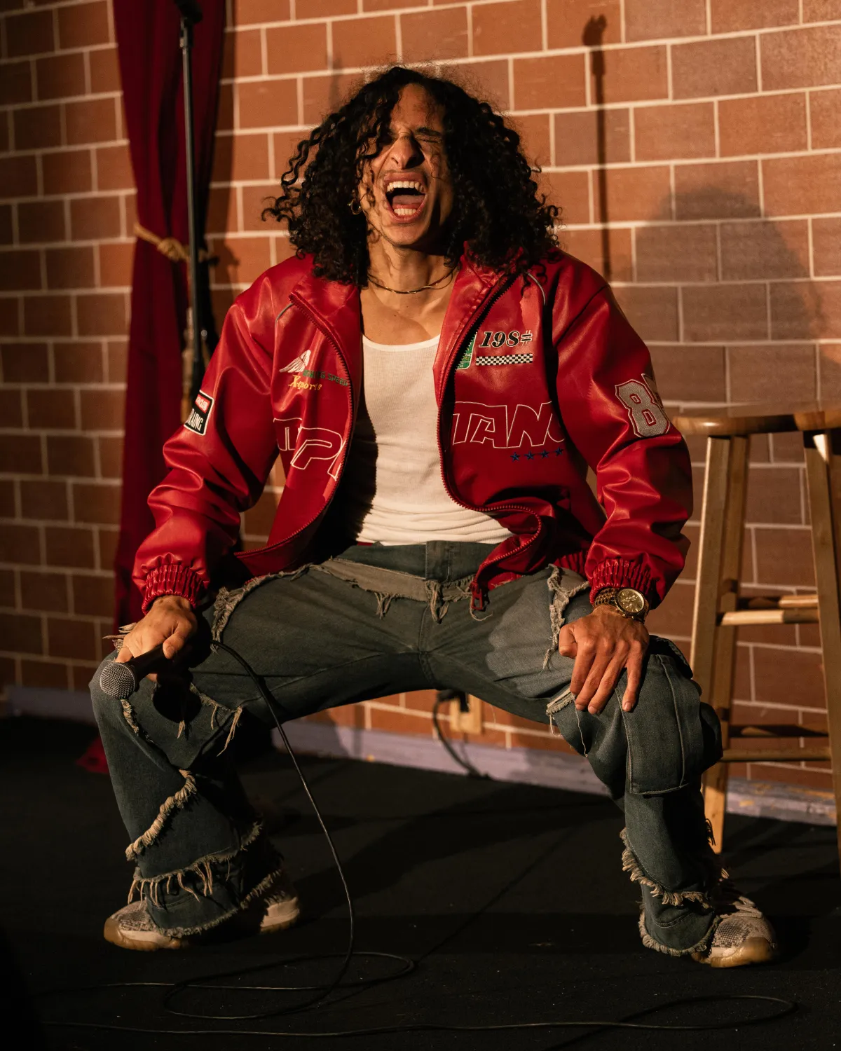 a man and a woman sitting on a couch drinking beer