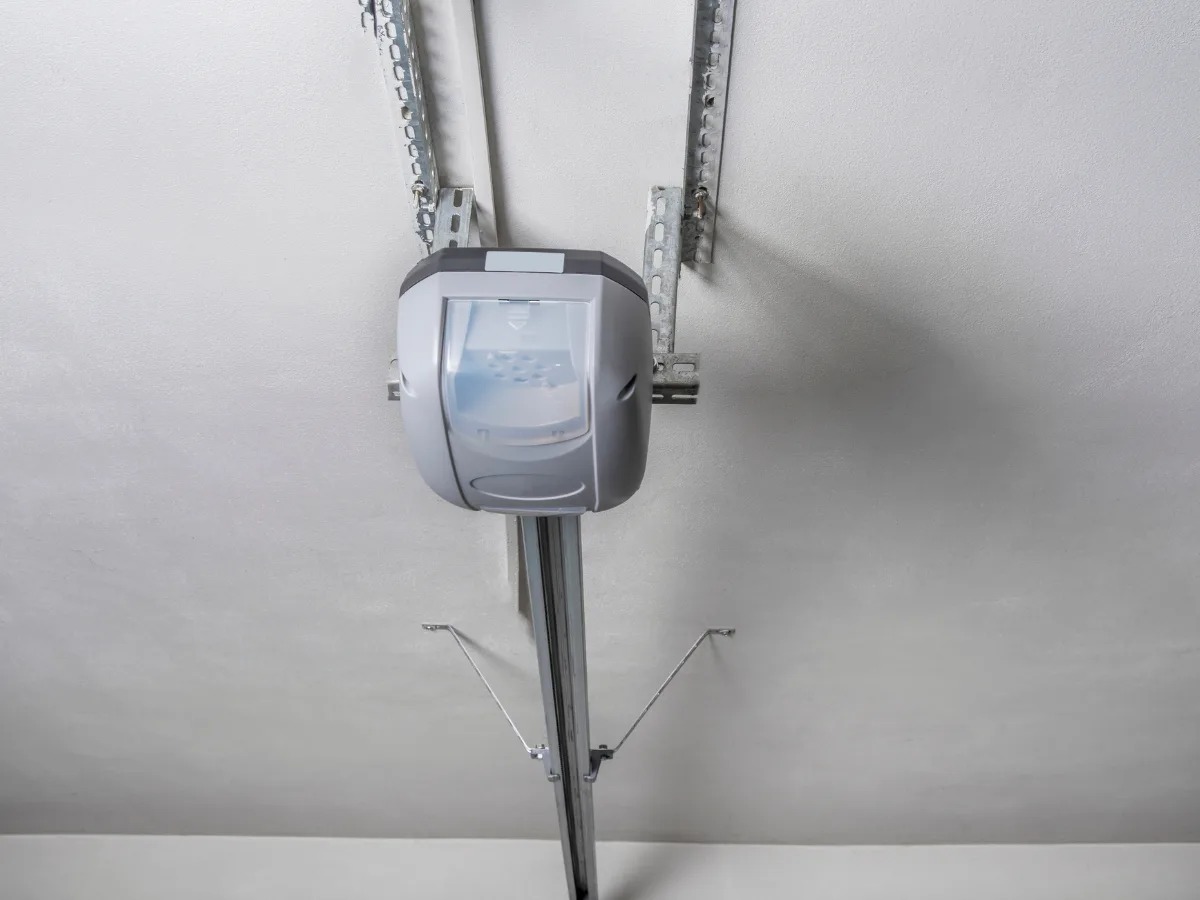 A garage door opener hangs from the ceiling.
