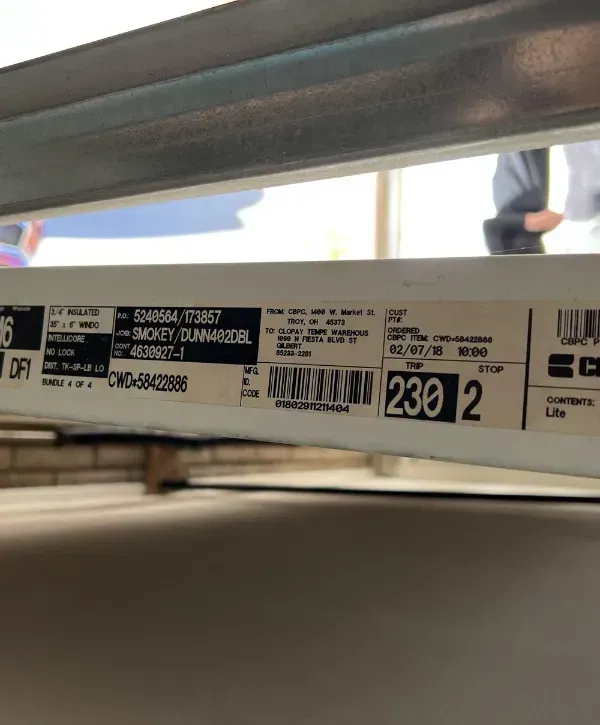 Close-up of garage door label with model and shipment details