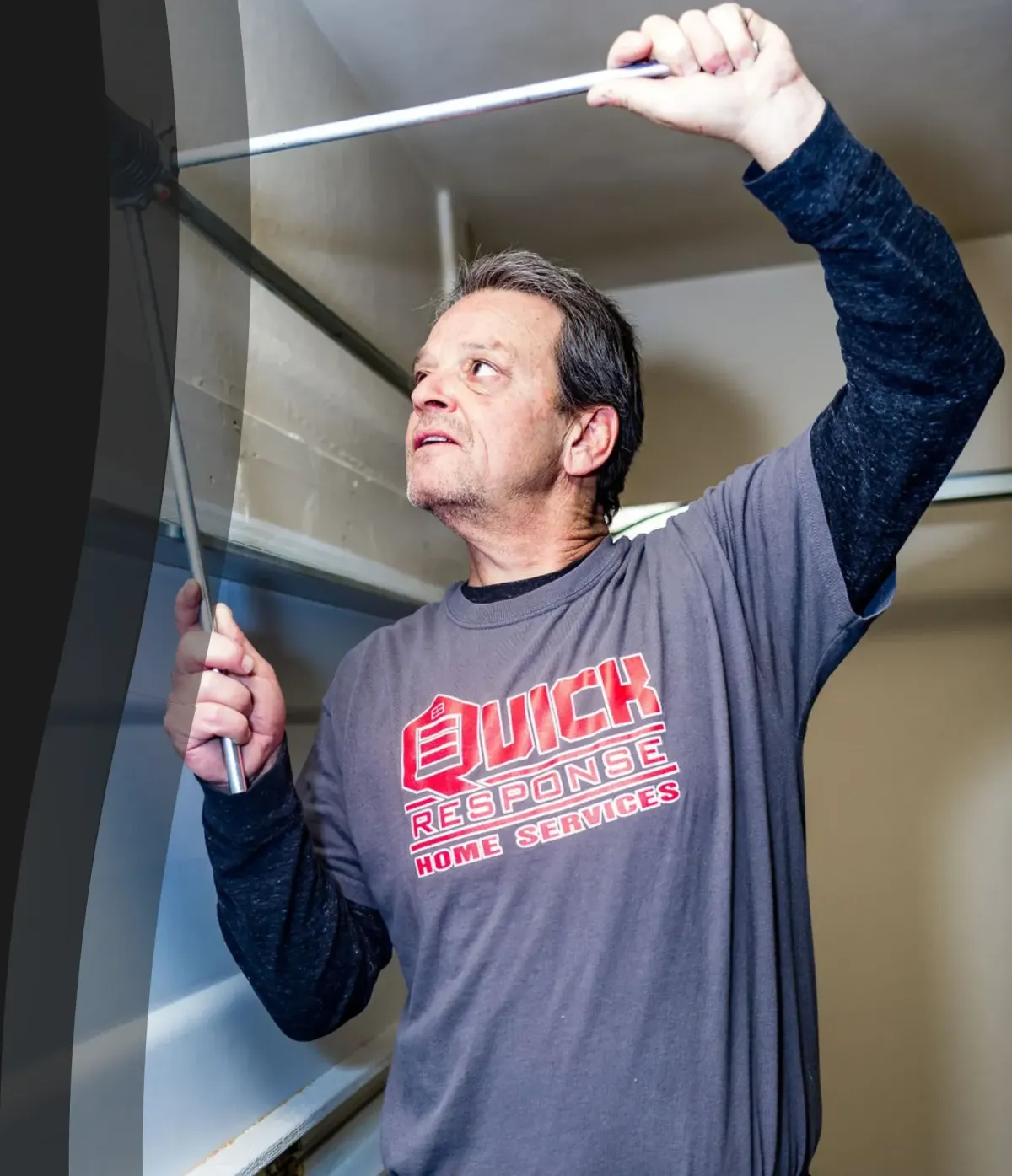 Danny, the owner of Quick Response Garage Door Services, doing a garage door repair job in Phoenix