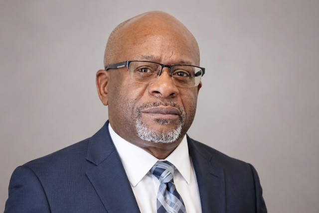 Professional headshot of Joe Glass