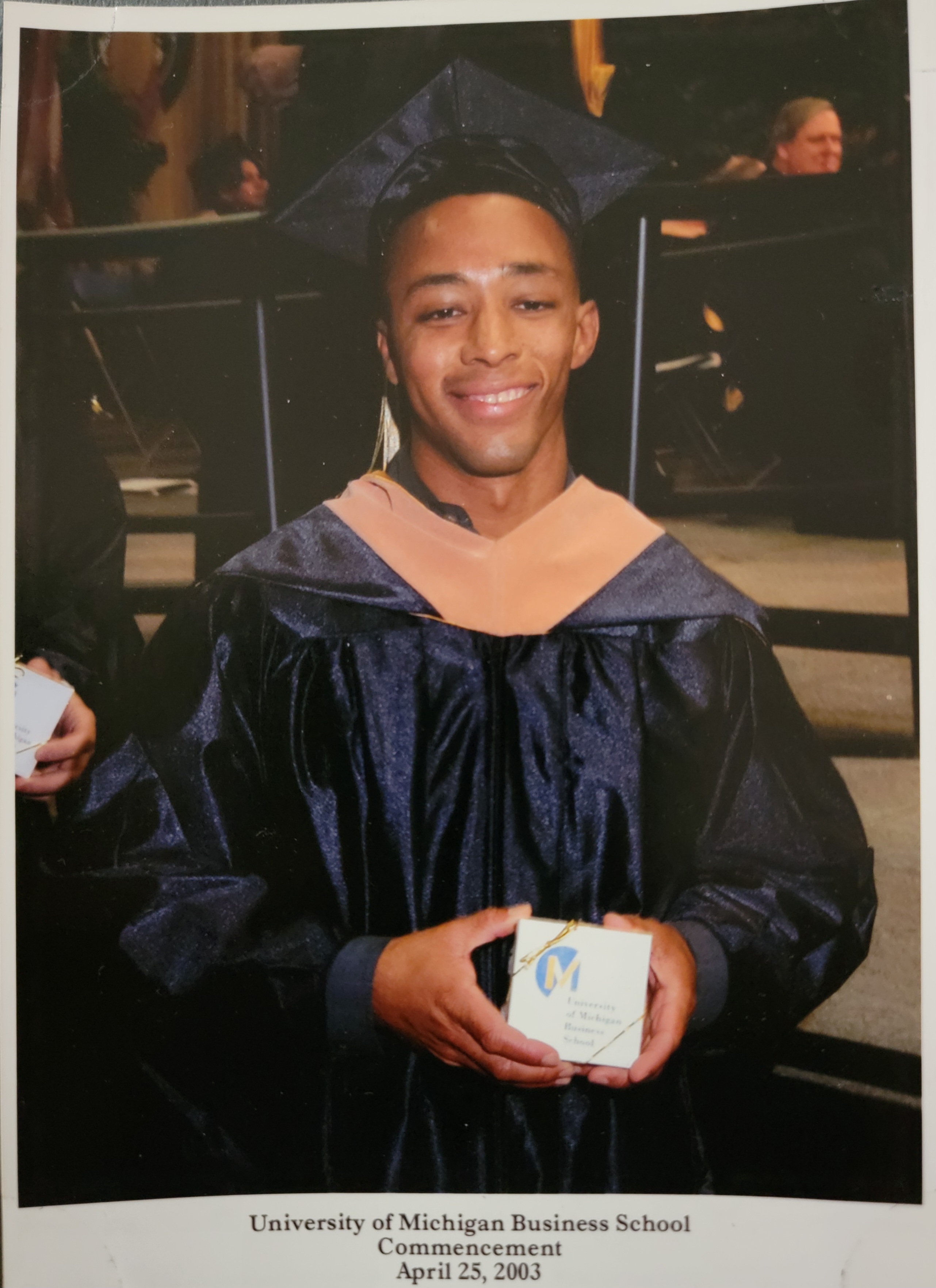Alain Leroy at his 2003 MBA graduation from the University of Michigan’s Ross School of Business, wearing academic regalia.