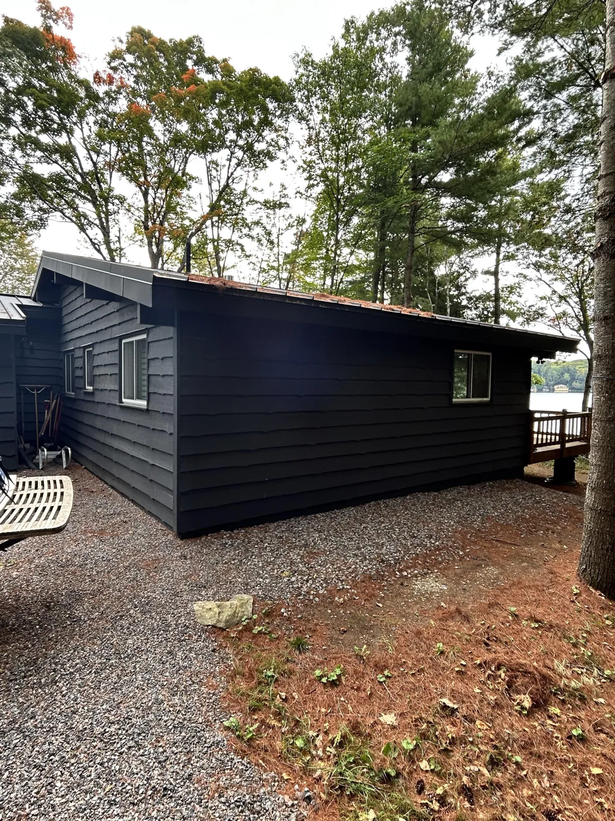 a bird is perched on the roof of a building