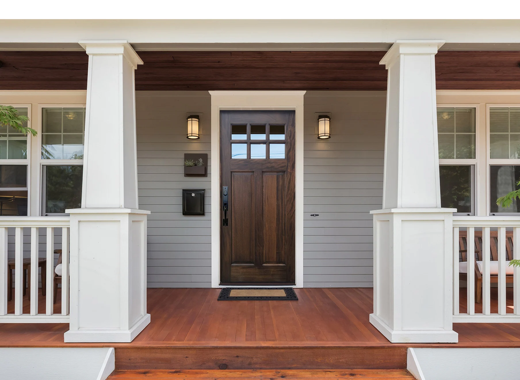 an entry door with white pillars