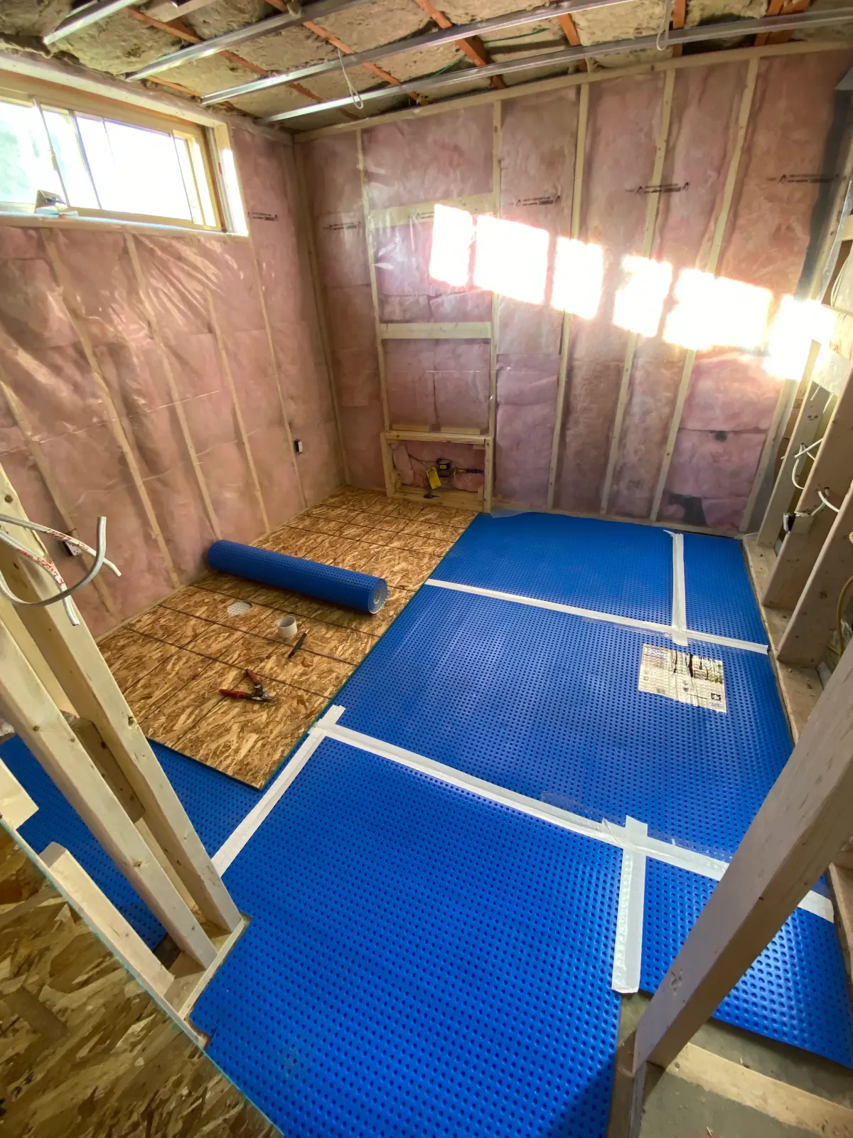 Stylish bathroom renovations in Etobicoke featuring a walk-in shower and modern vanity.