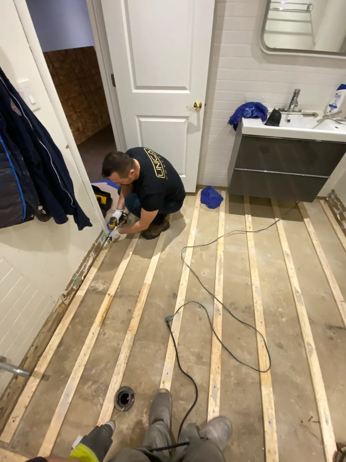 Toronto office renovation transforming a dated boardroom into a sleek, high-tech conference room.