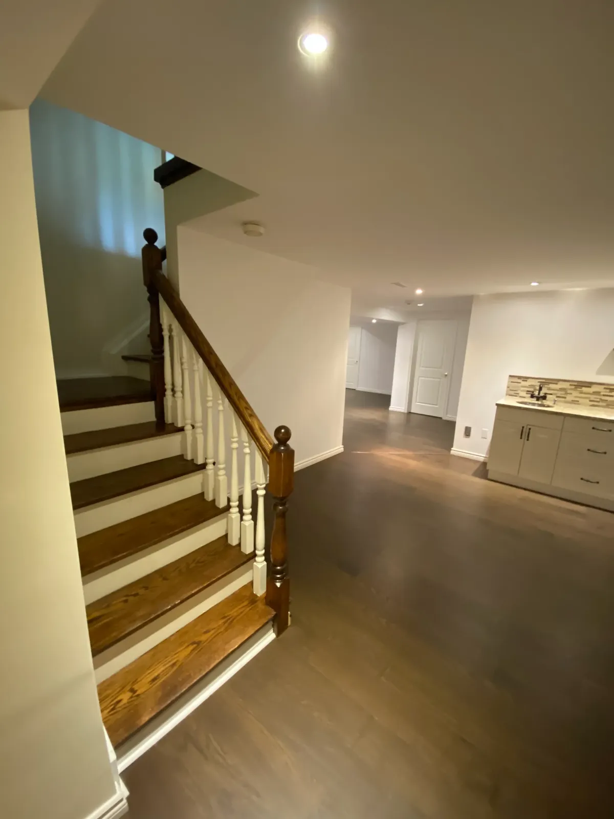 Basement finishing project in Toronto transformed an empty space into a cozy entertainment room.