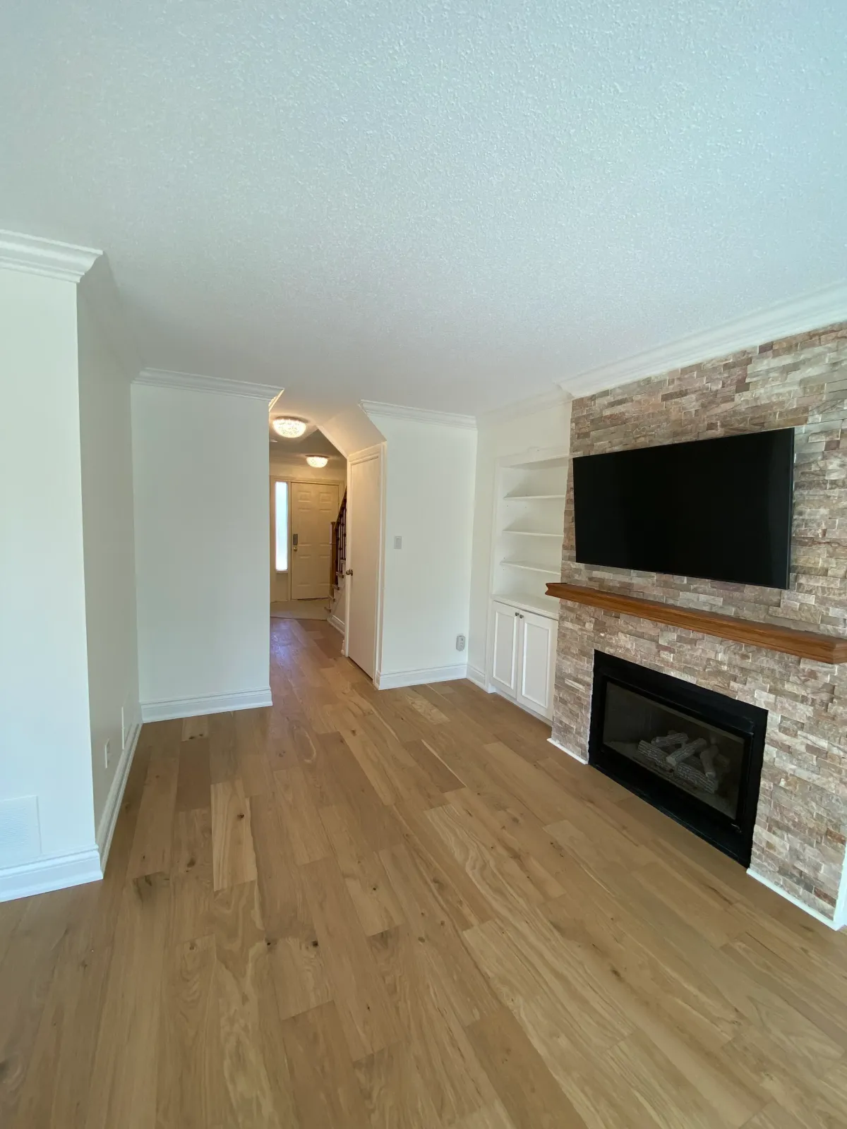 Basement finishing project in Toronto transformed an empty space into a cozy entertainment room.