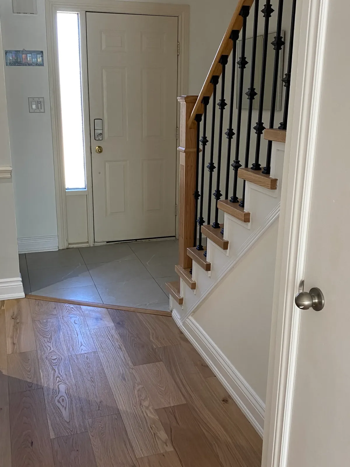 Victorian house renovation in Toronto updated with modern interiors while preserving original charm.