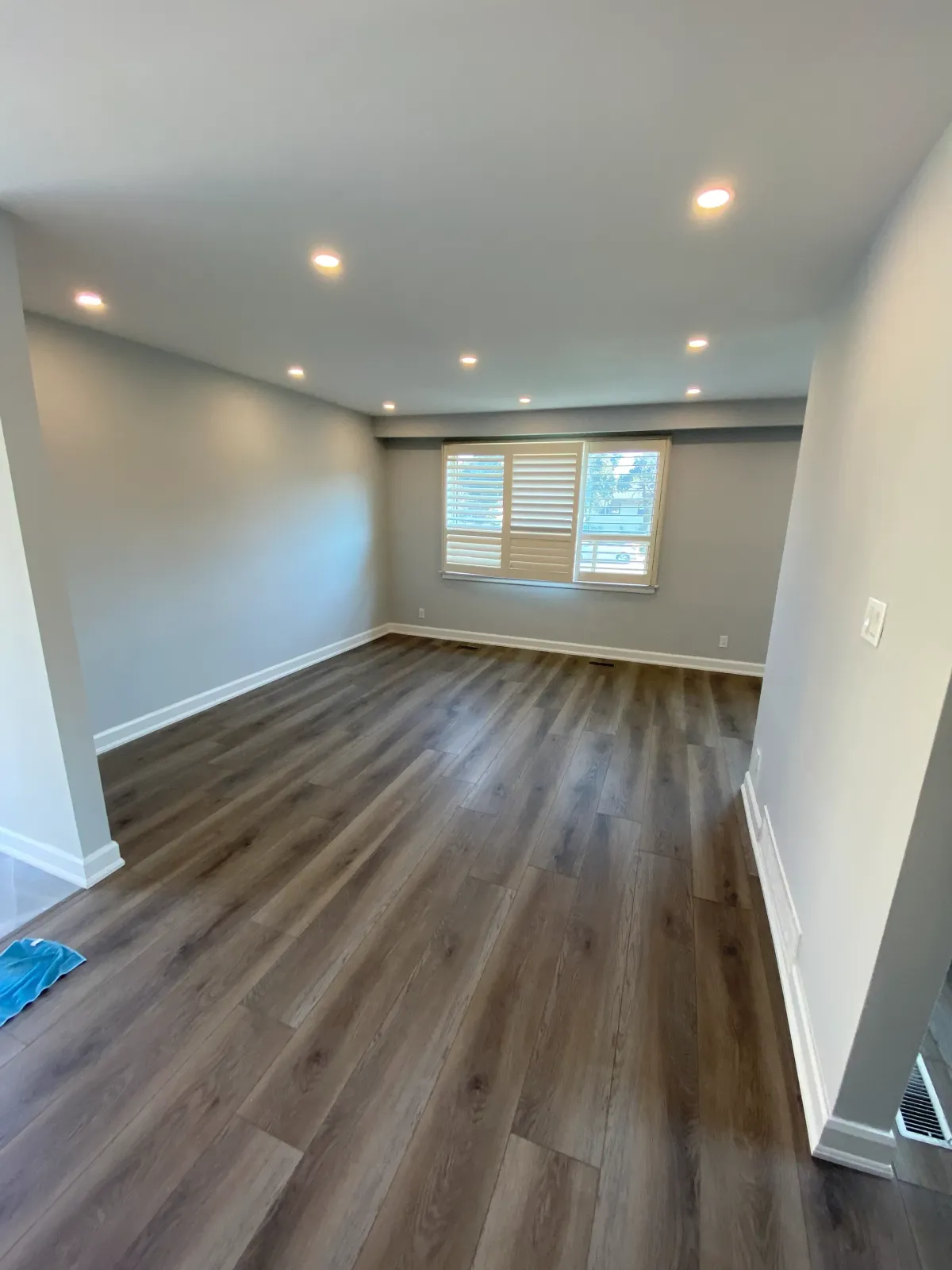 Spacious basement renovation in Toronto transformed an unfinished cellar into a cozy family room.
