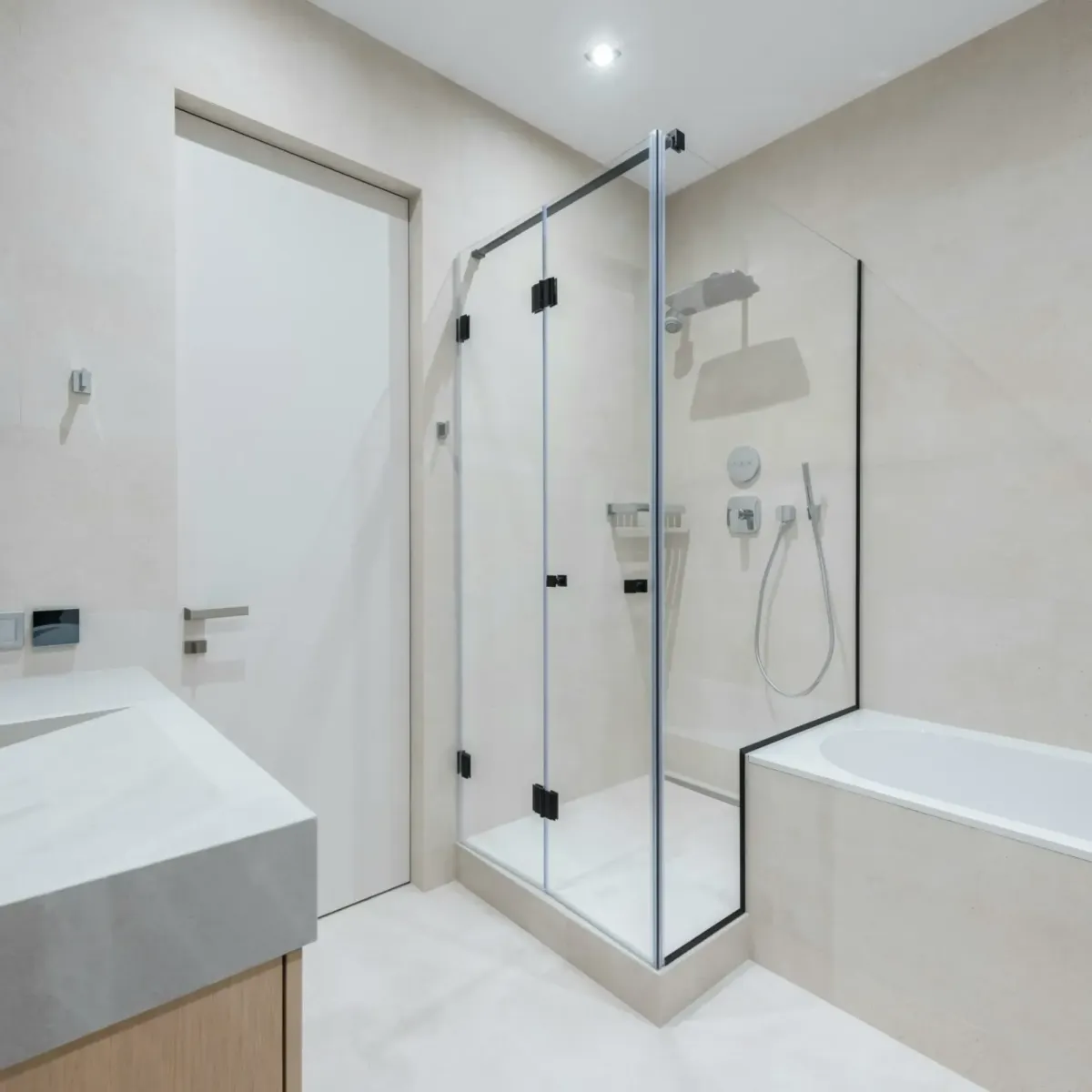 Luxurious bathroom renovation in Toronto featuring a spa-like walk-in shower and marble tiles.