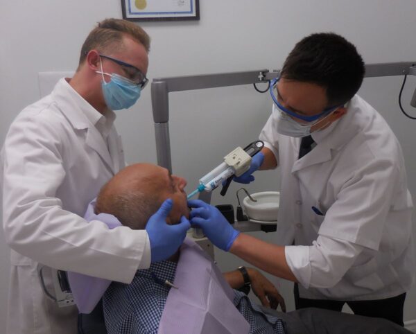 woman with silver and yellow hoop earrings
