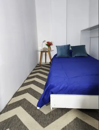 black flat screen tv on white wooden tv rack