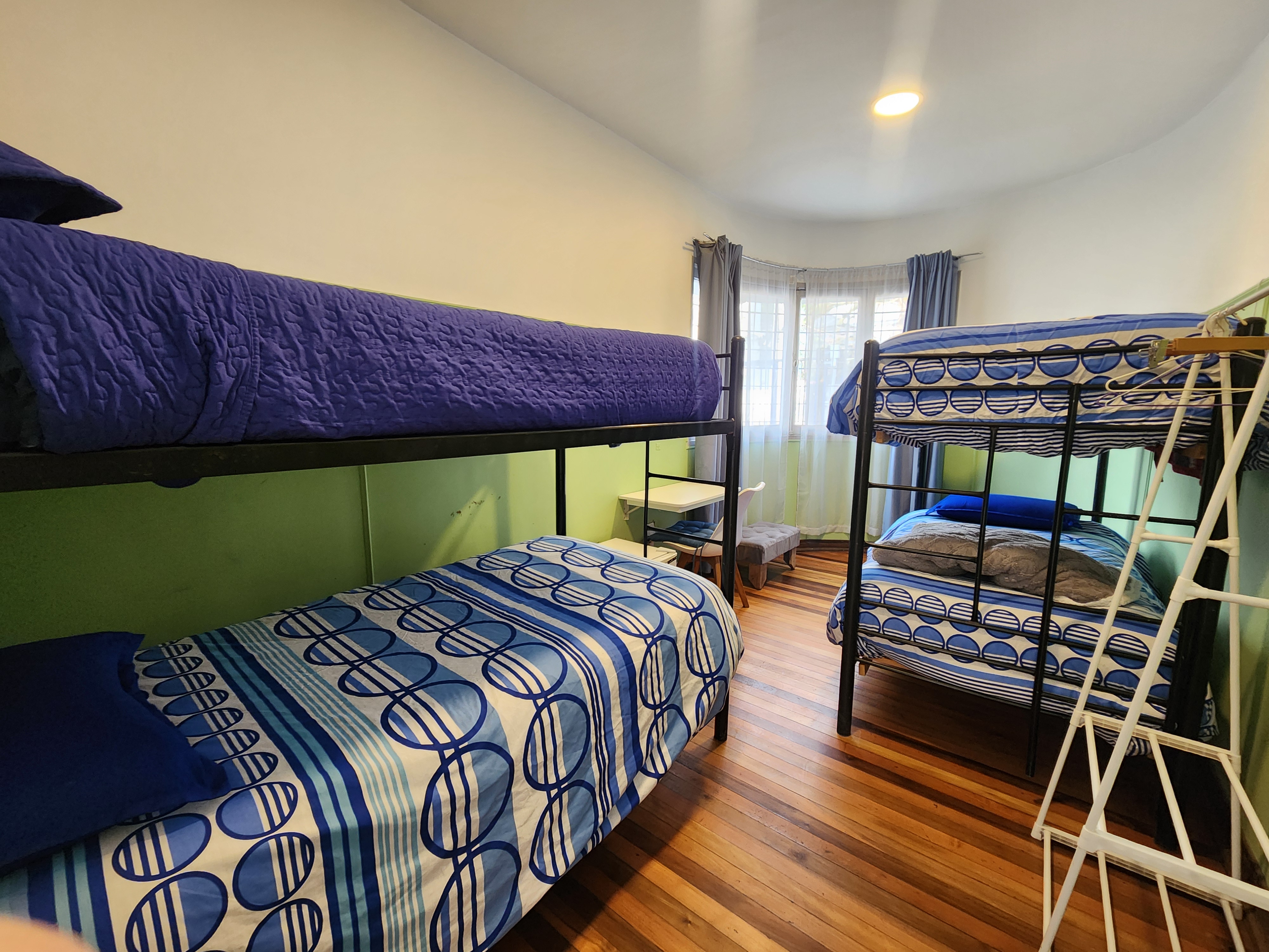 A woman in a pink silk pajama set