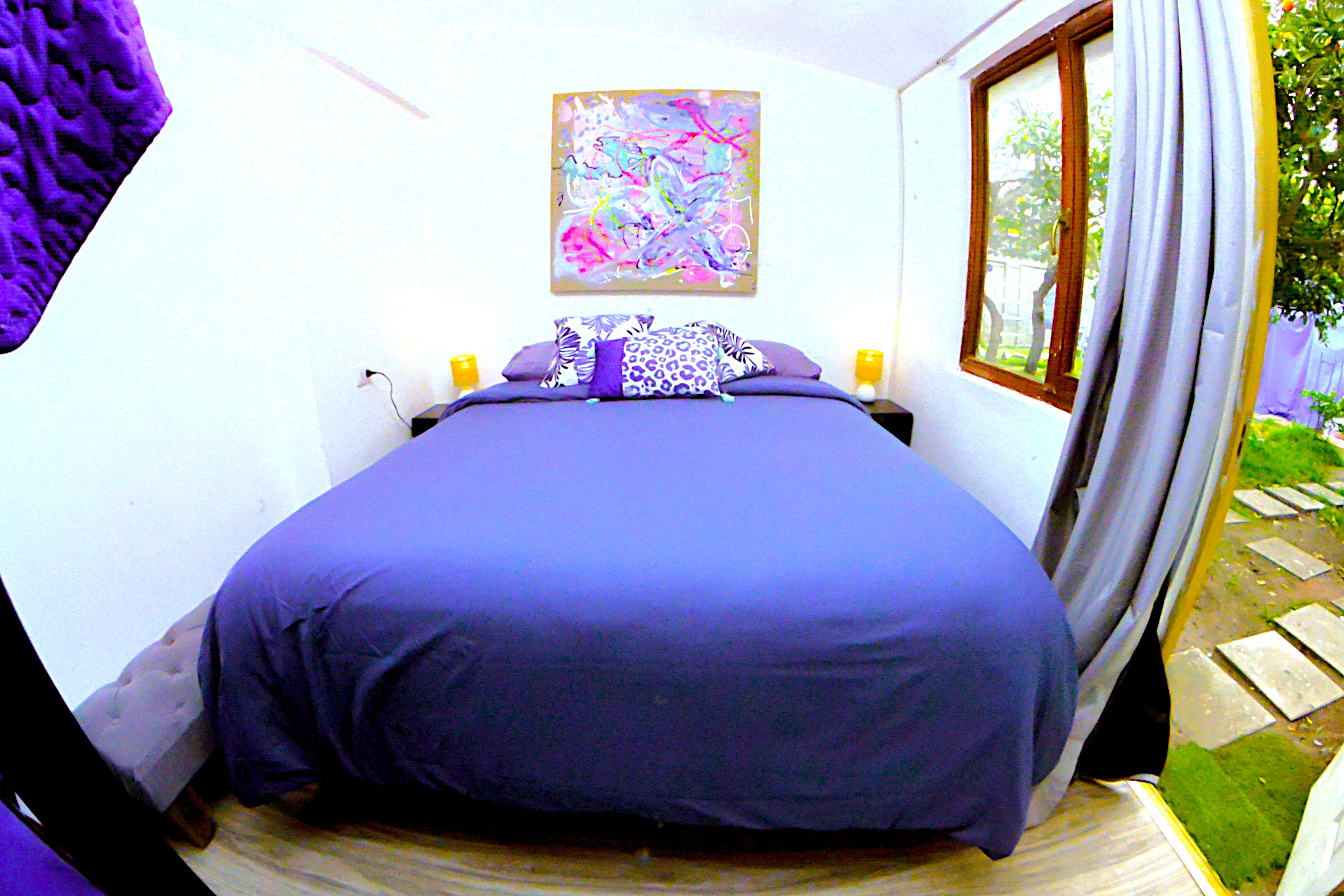 a bedroom with a bed and a table