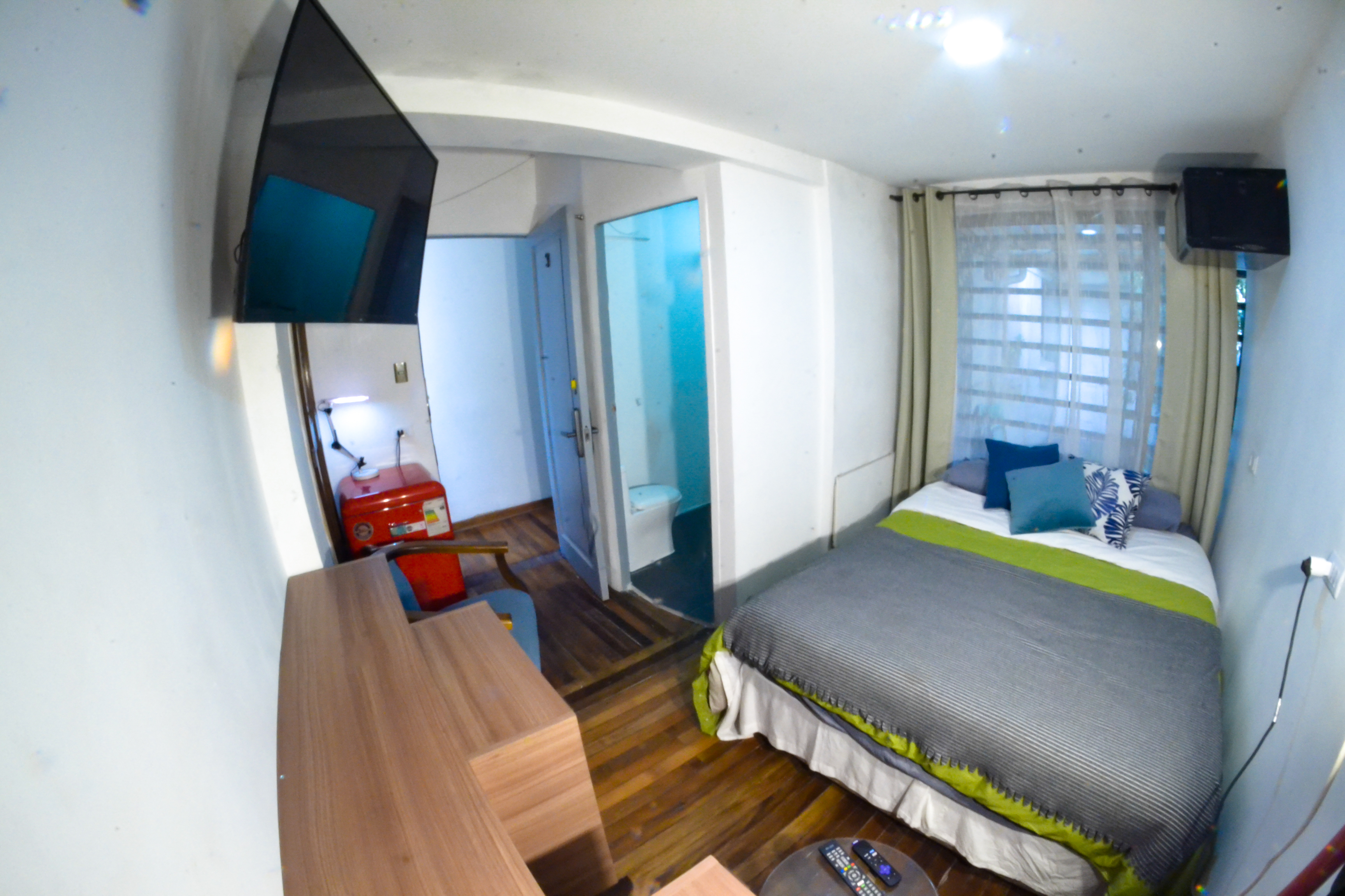 a bedroom with a bed and a table