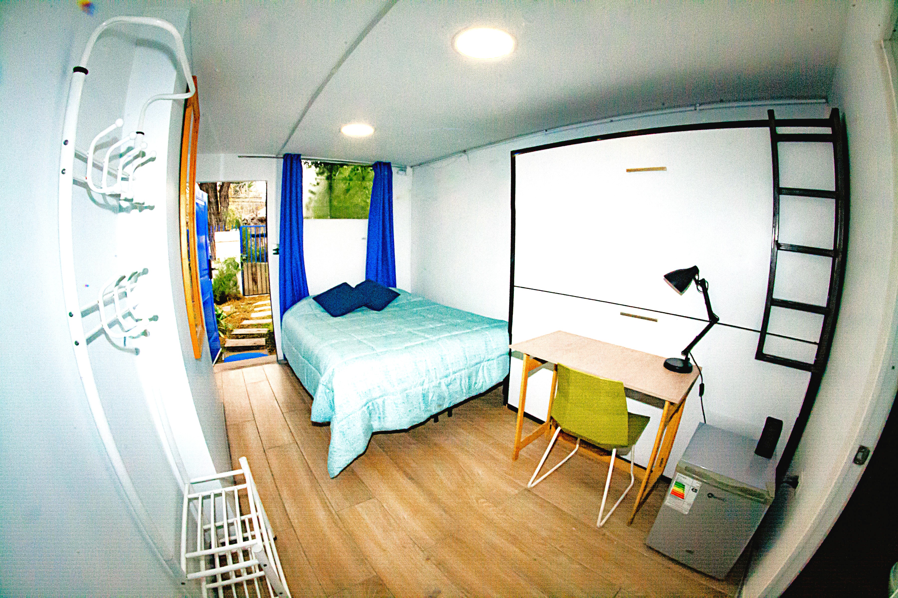 a bedroom with a bed and a table