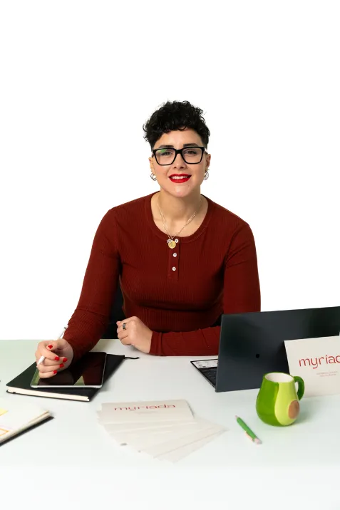 A serene, sunlit therapy office with a comfortable armchair, a small table with a plant, and soft natural light streaming through large windows. The space feels welcoming, calm, and private, inviting individuals to relax and open up.