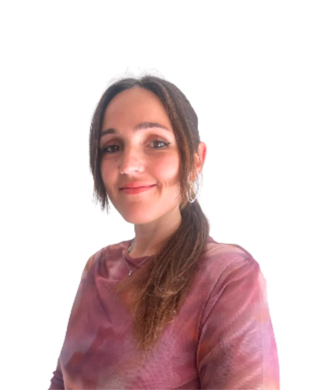 A middle-aged female therapist with short curly hair, wearing glasses and a soft blue blouse, sits in a modern office with bookshelves and plants. She smiles warmly, exuding trust and professionalism.