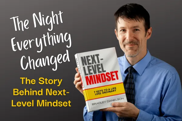 Author Bradley Danielson holding up his book "Next-Level Mindset: 7 Keys to a Life Less Ordinary" with the caption "The Night Everything Changed - The Story Behind Next-Level Mindset"
