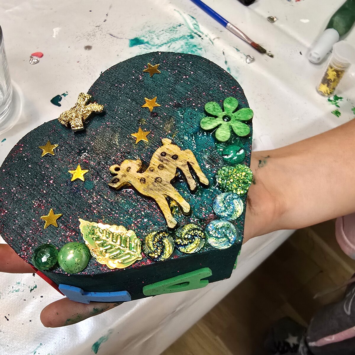 A heart with a golden deer, made by a grown-up