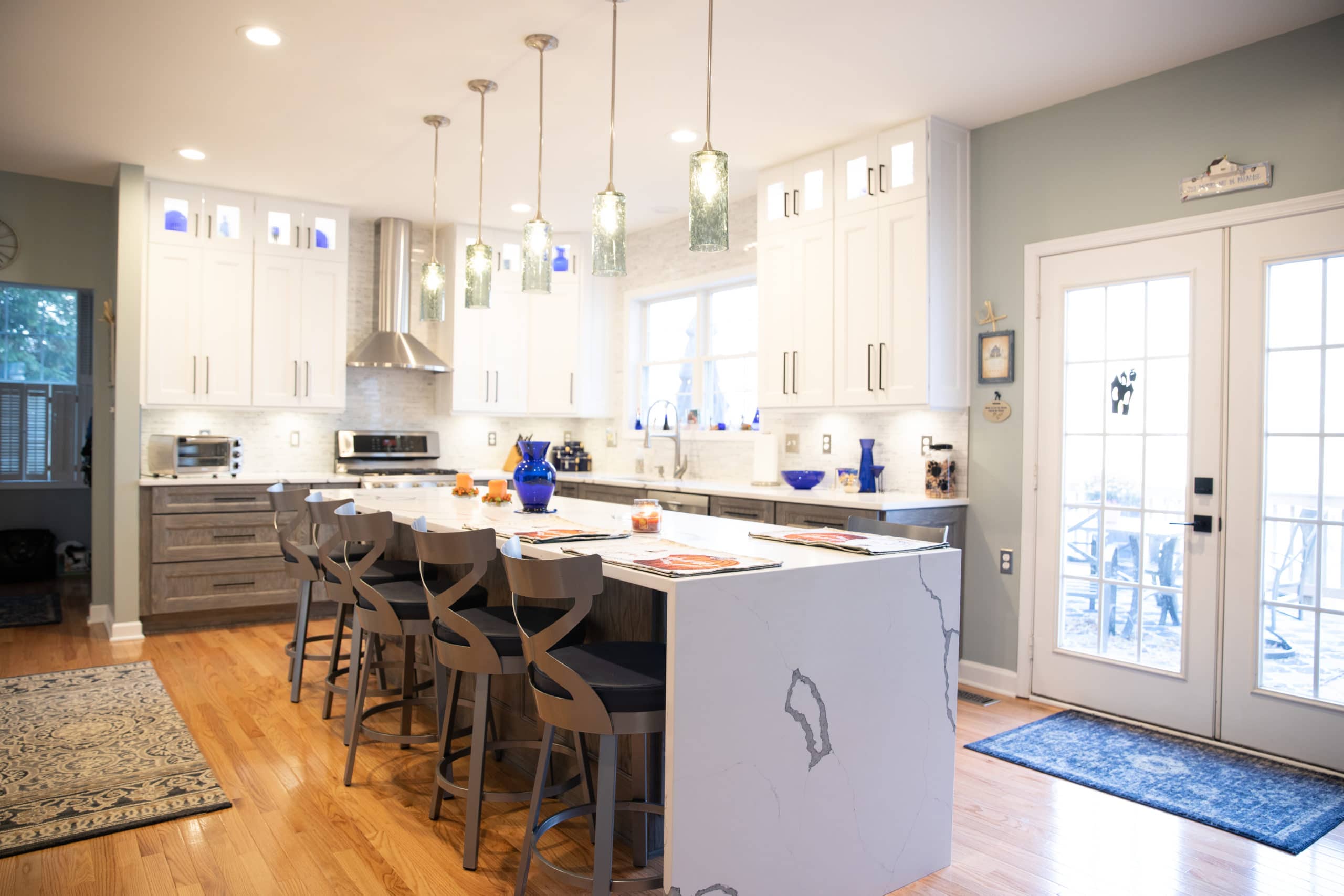 Minimalist kitchen featuring smart storage solutions in Takoma Park home