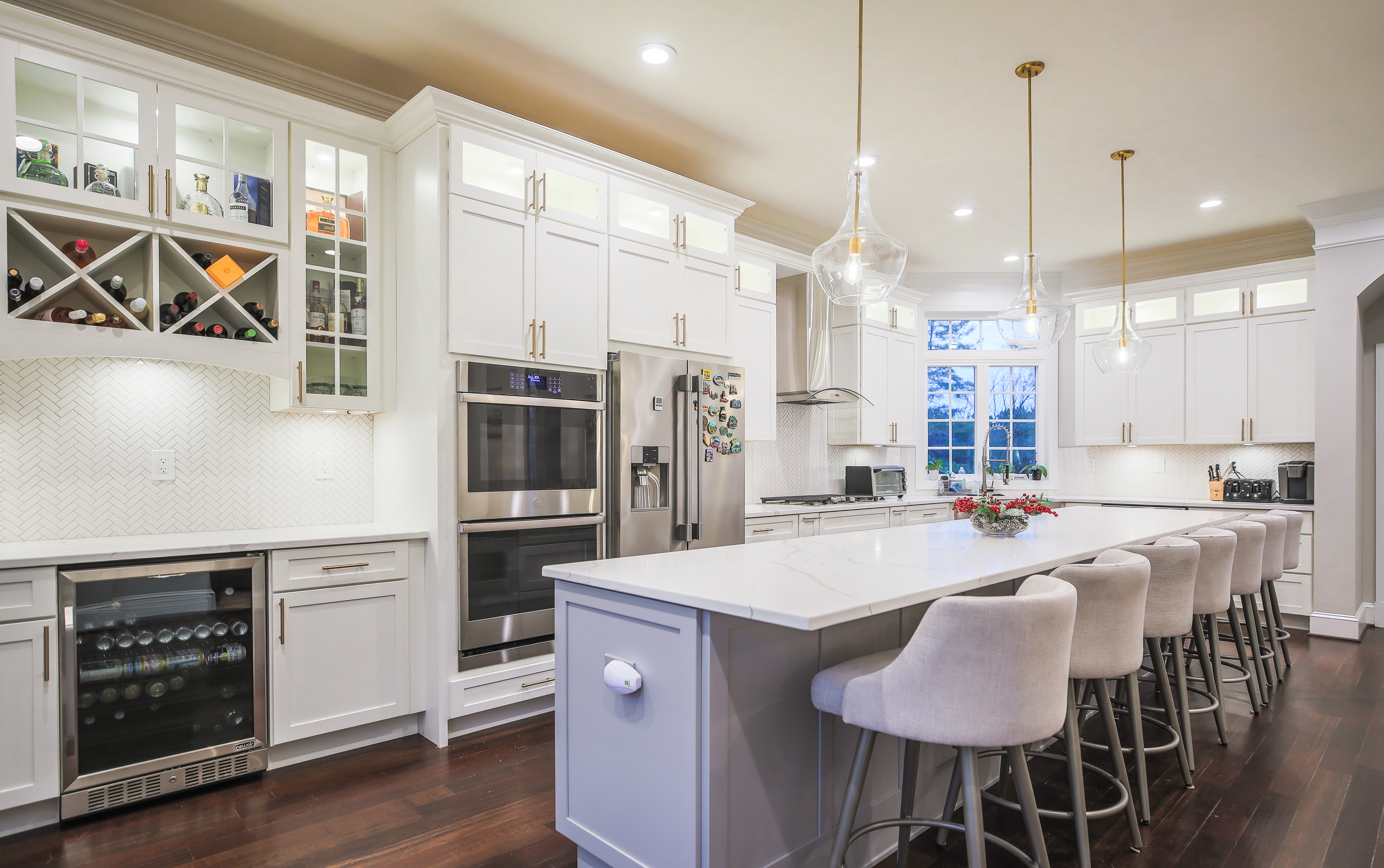 Kitchen island with seating and pendant lights in Chevy Chase MD