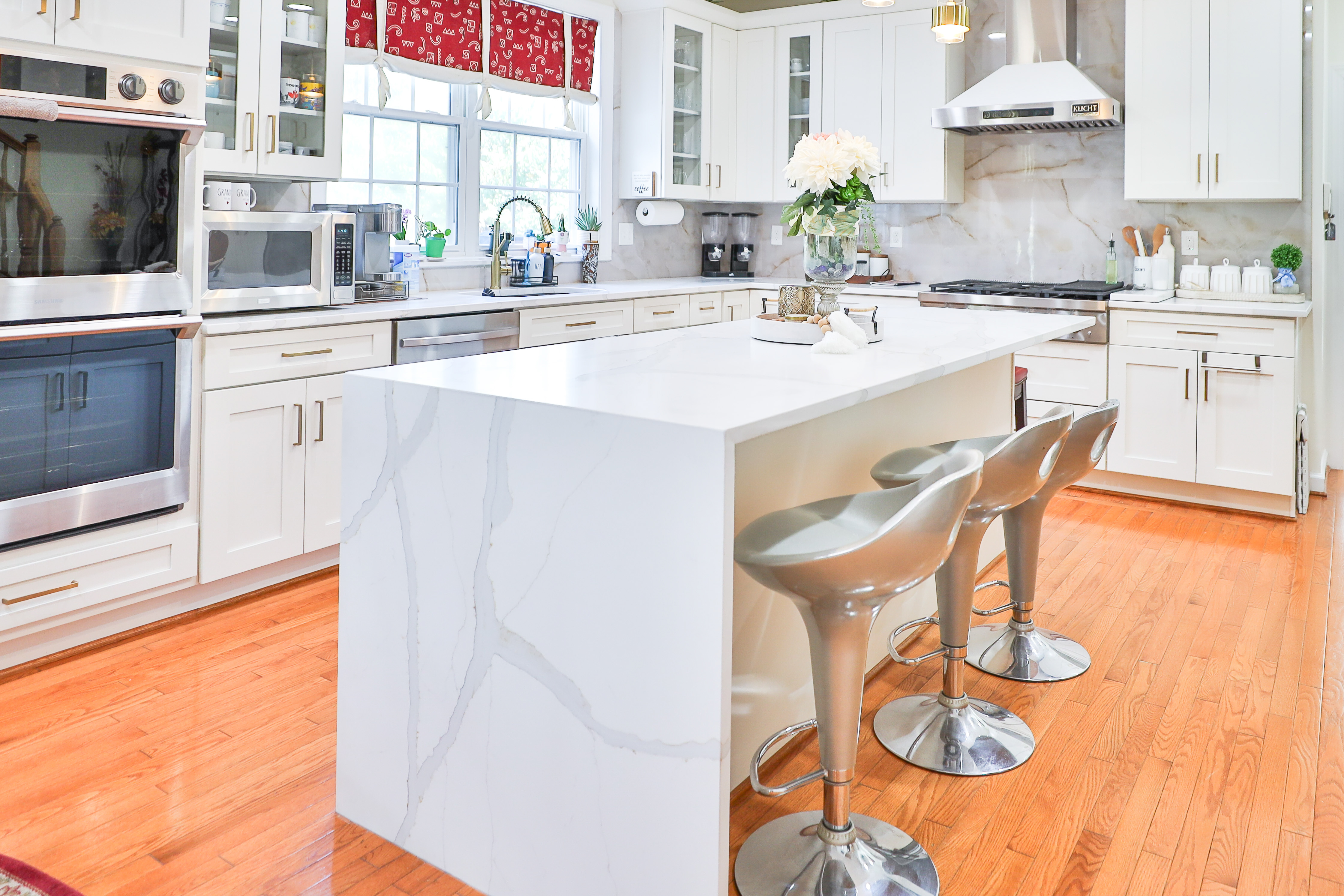 Sleek white kitchen cabinets with built-in appliances in Silver Spring MD