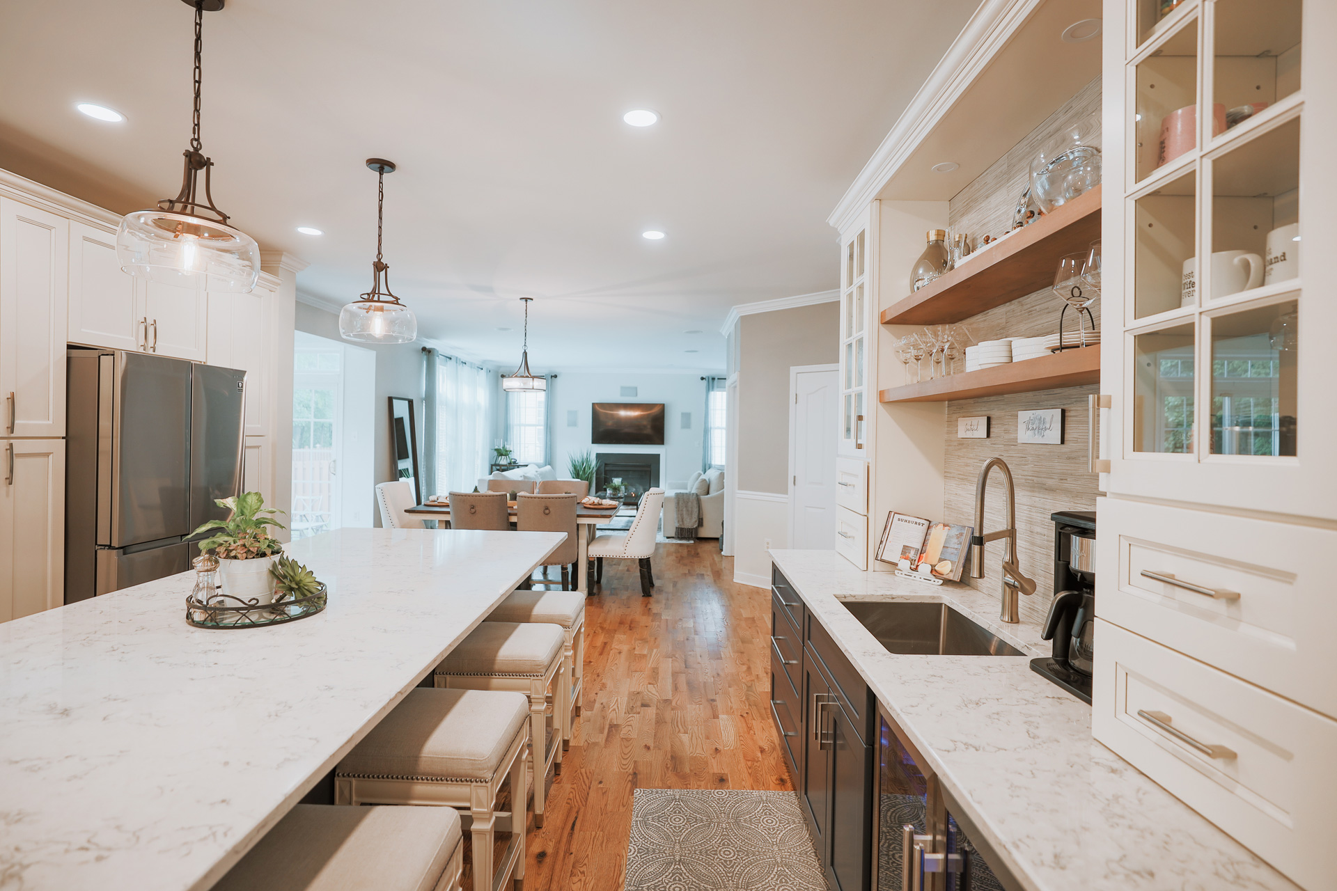 Sleek white kitchen cabinets with built-in appliances in Washington DC