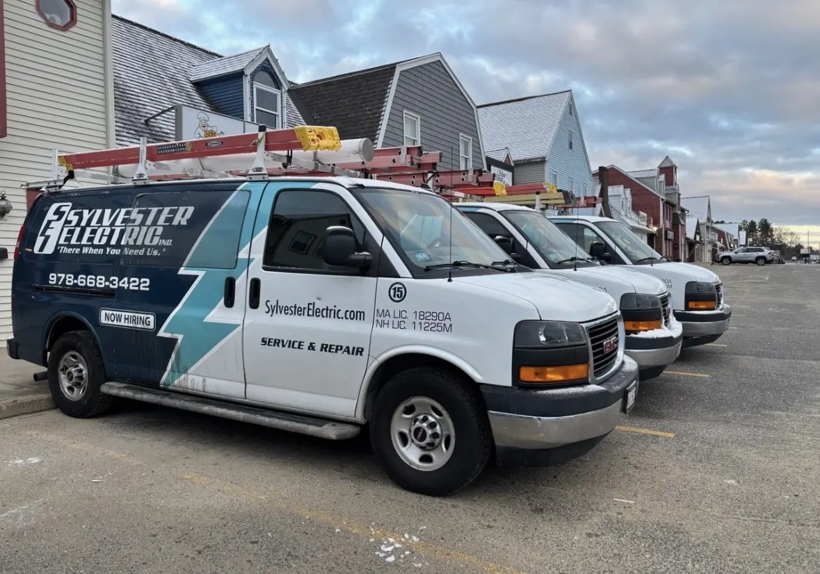 Sylvester Electric service vans parked together.