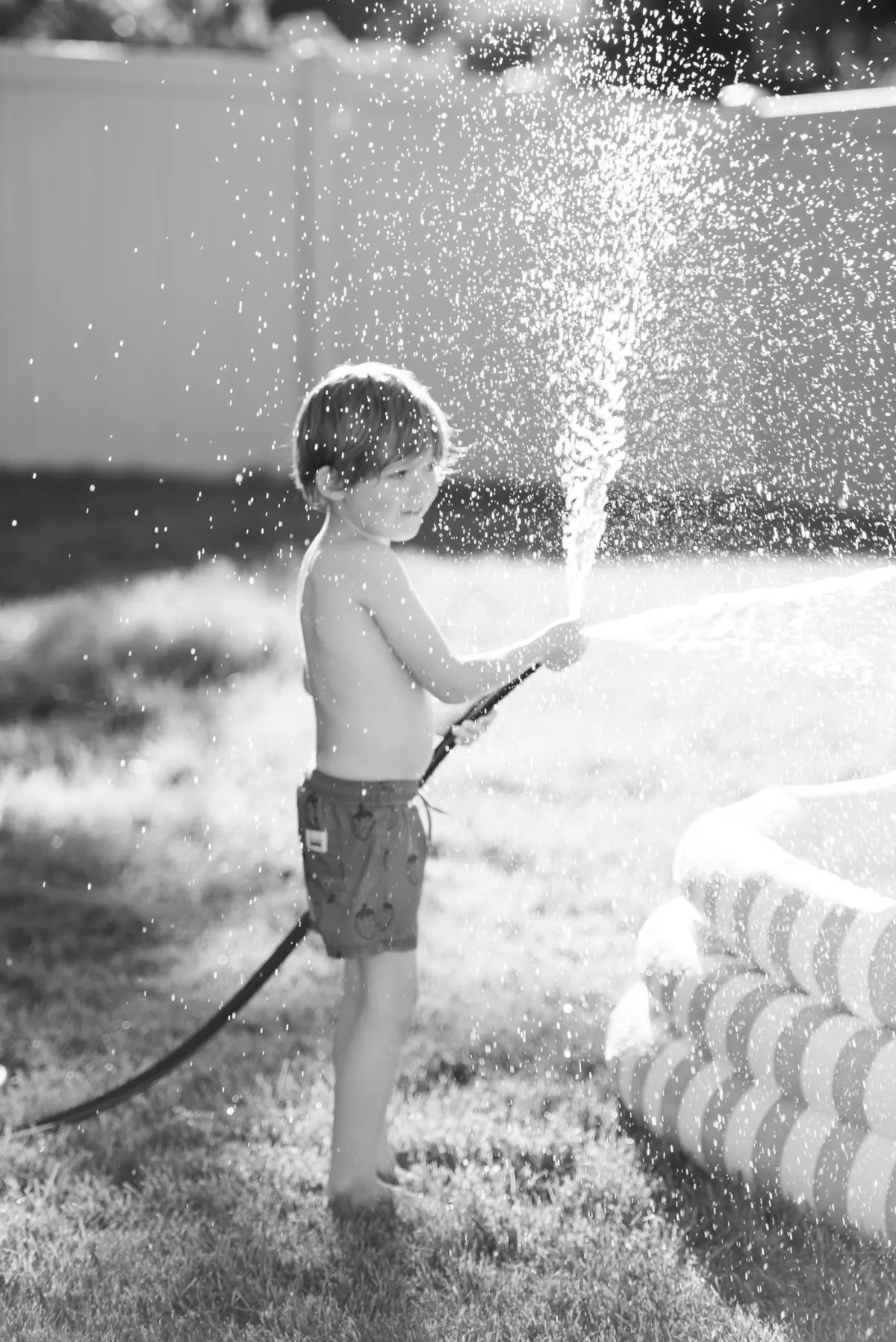 Child-playing-with-hose