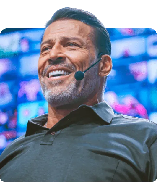 Portrait of the primary coach in soft studio lighting, conveying mastery and approachability.