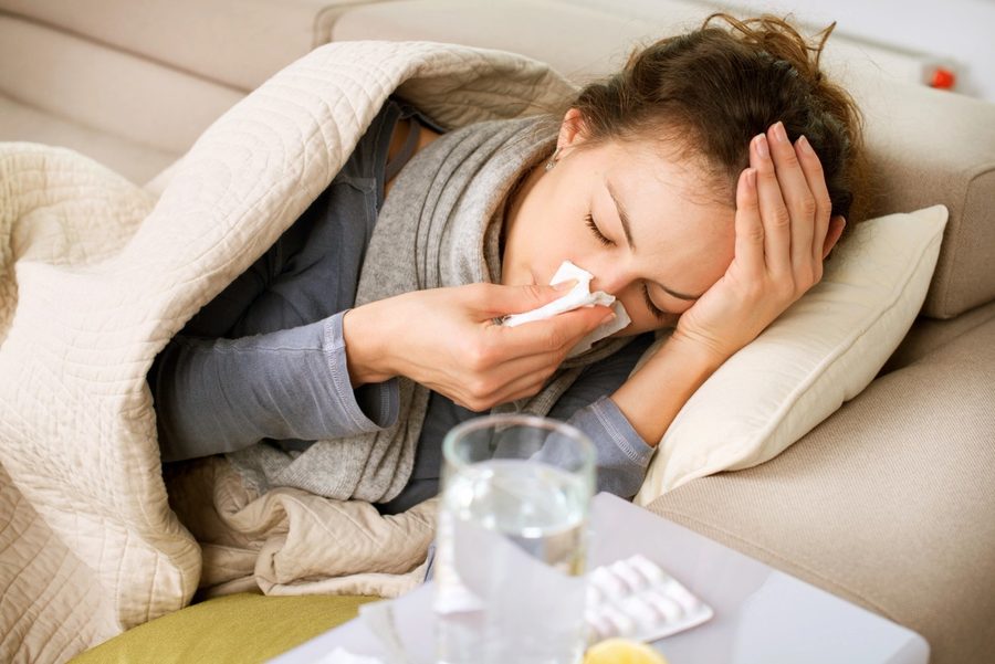 A person managing everyday health tasks at home