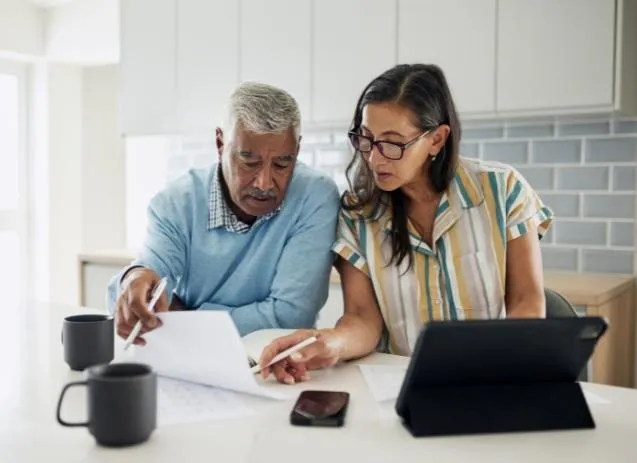 woman in black jacket holding white paper