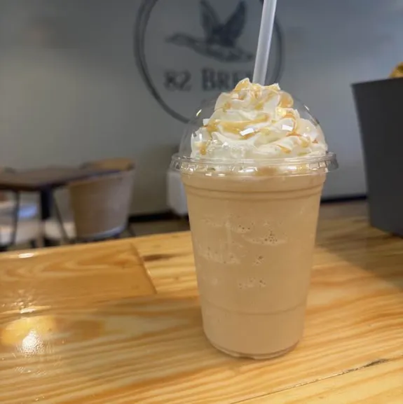 Vanilla frappe with whipped cream at 82 Brew coffee shop