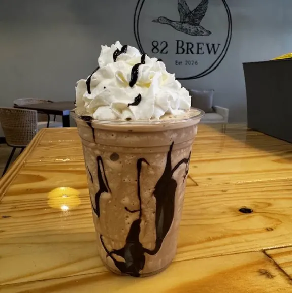 Chocolate frappe topped with whipped cream at 82 Brew coffee shop