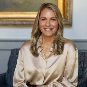 Kristi Rowland, Austin luxury real estate advisor standing in an architecturally refined Hill Country home