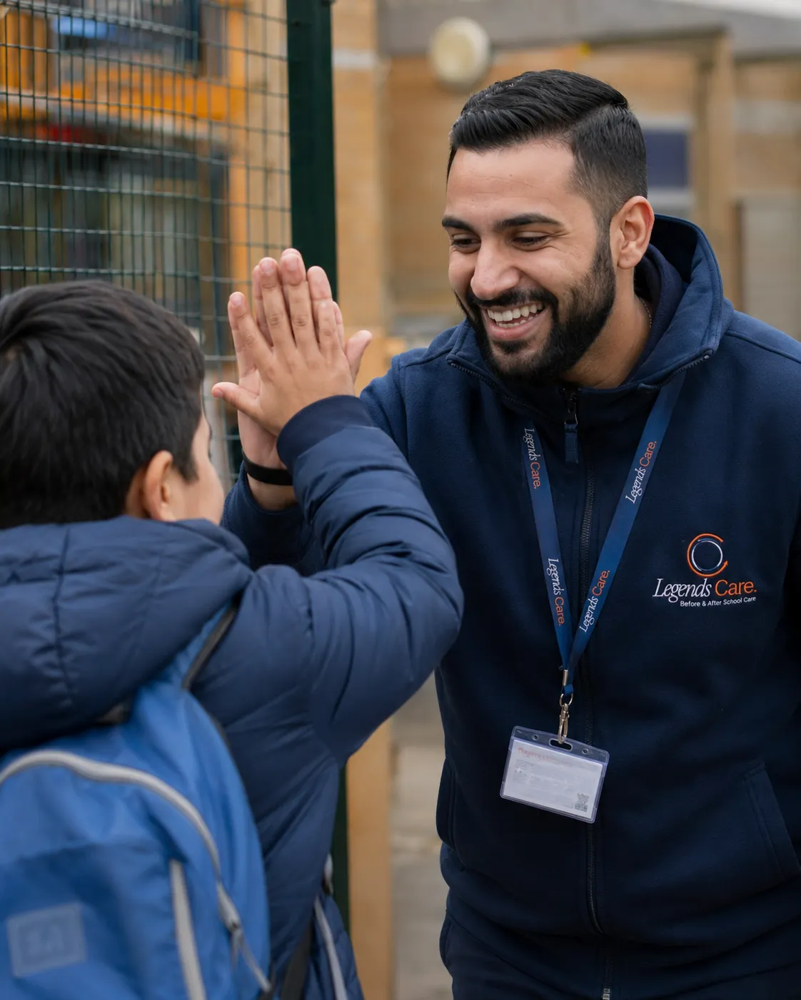 Teacher encouraging child at legends care.