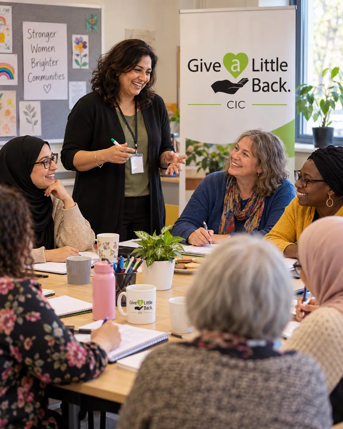 Dedicated community tutor supporting students in a Huddersfield workshop