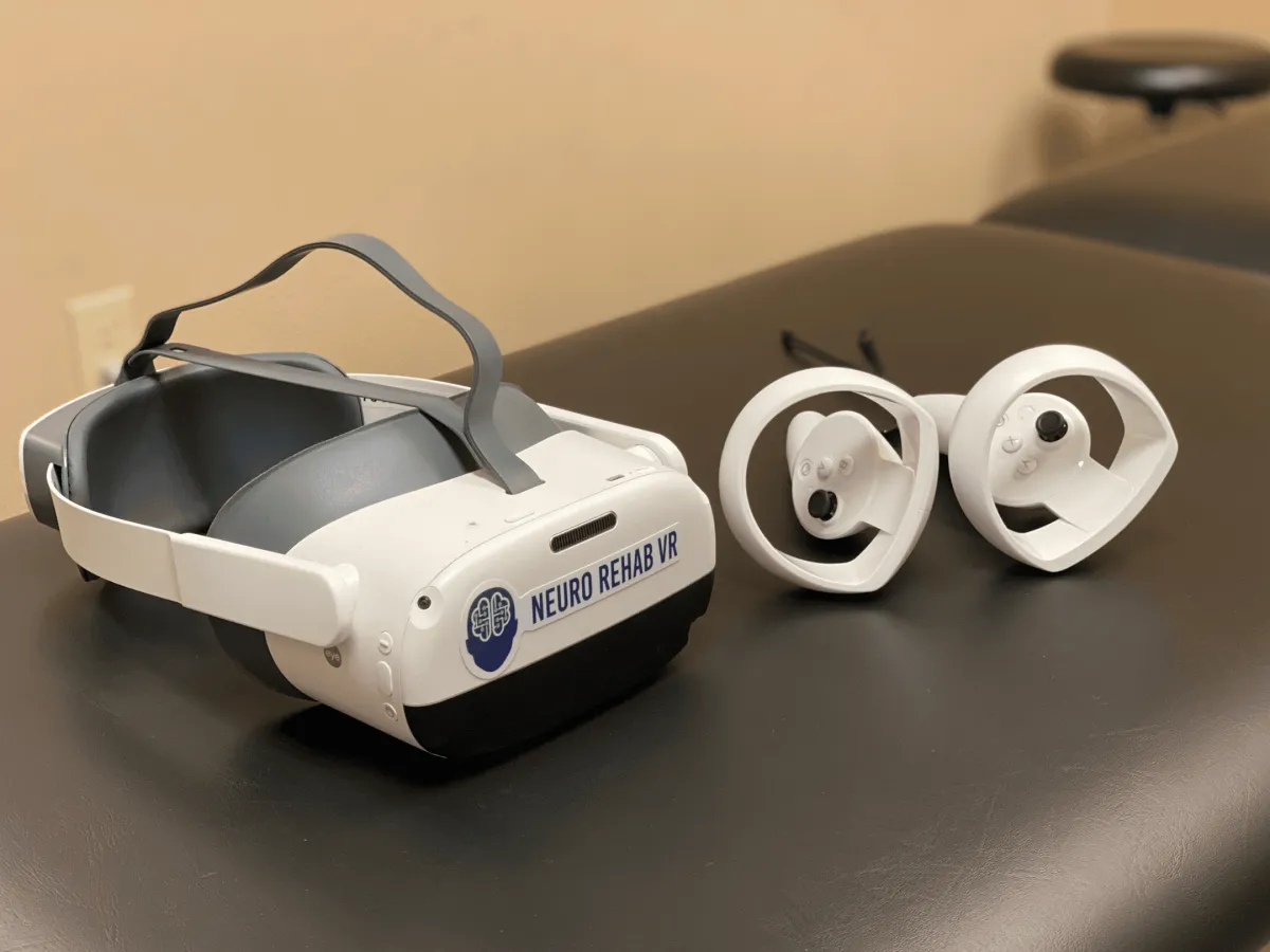 State-of-the-art Neuro Rehab VR equipment, including a virtual reality headset and controllers, ready to deliver an immersive physical therapy experience at PhysioFIT.