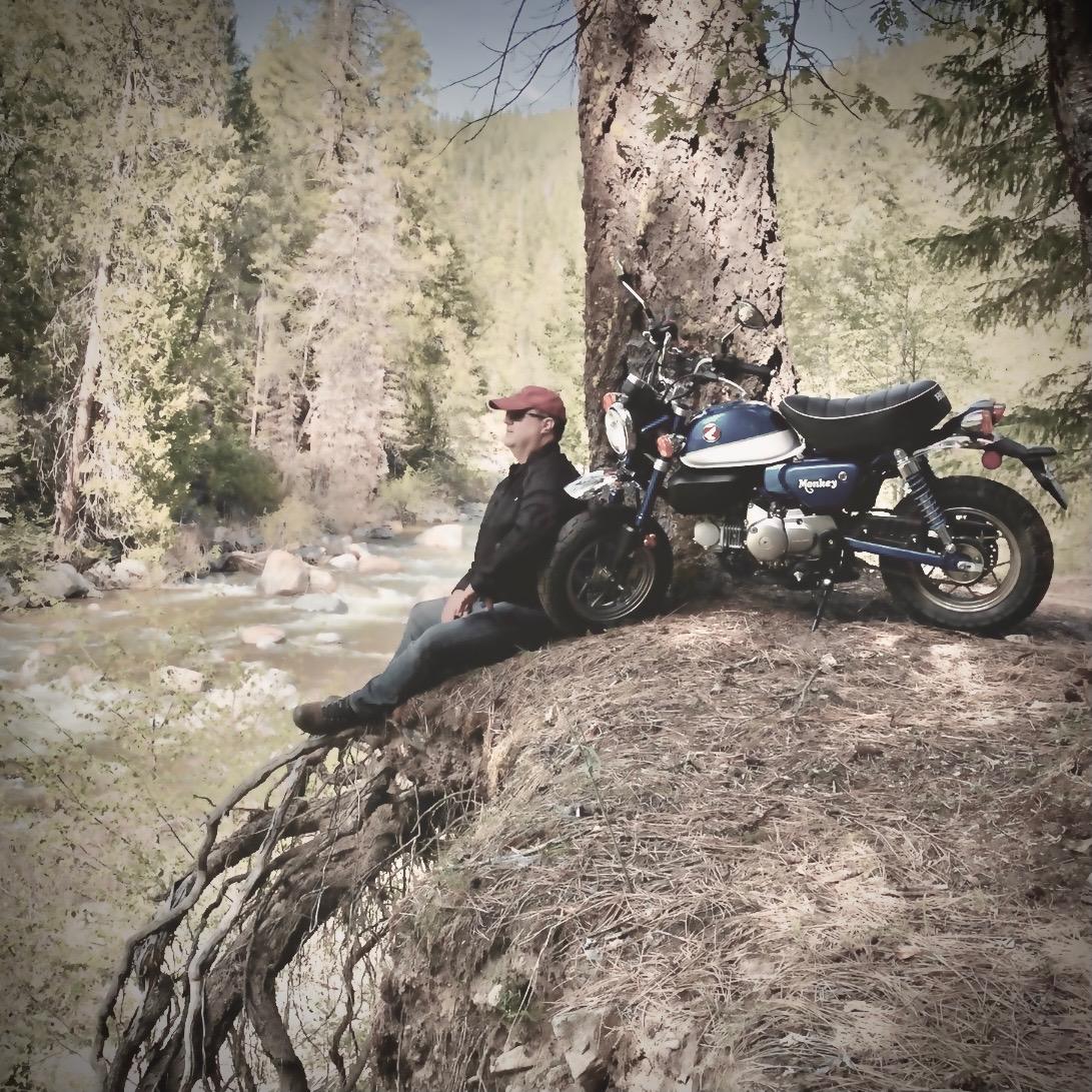 a man climbing up the side of a mountain