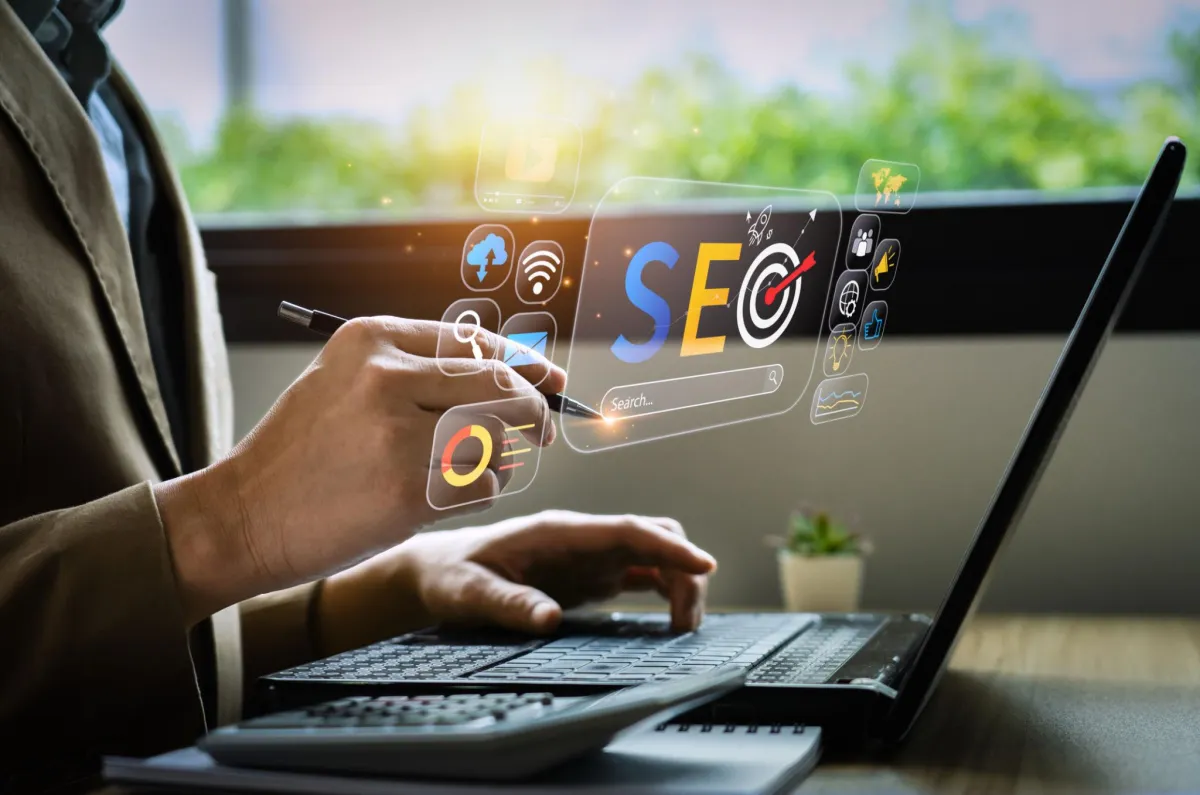 MacBook Pro near green potted plant on table