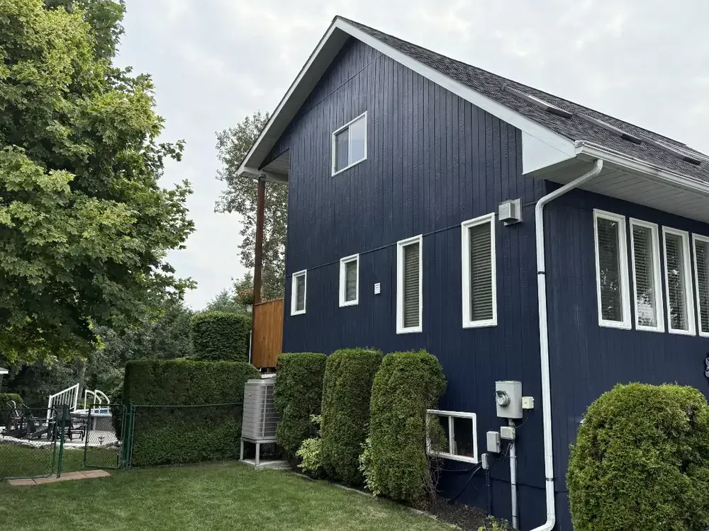 Navy siding home exterior painted by Turtle Painting in Barrie