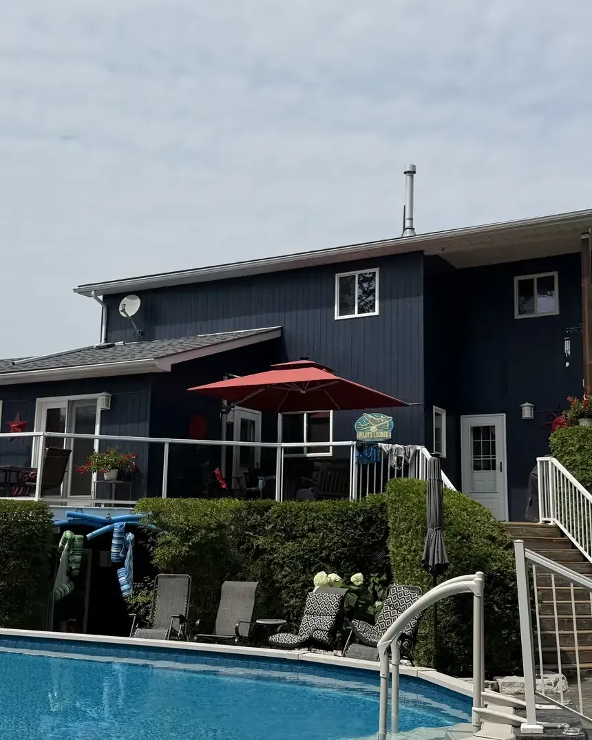 Navy board and batten home exterior painted by Turtle Painting