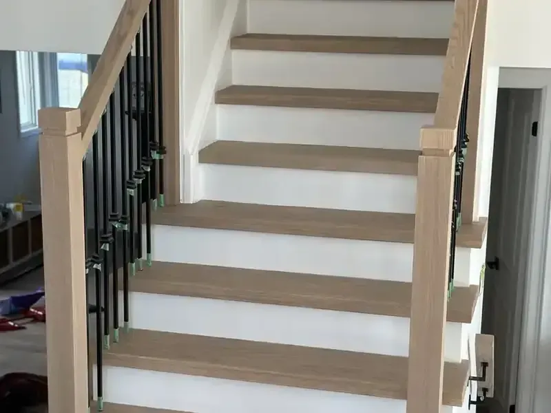 Staircase: Stained treads, white risers, painted by Turtle Painting