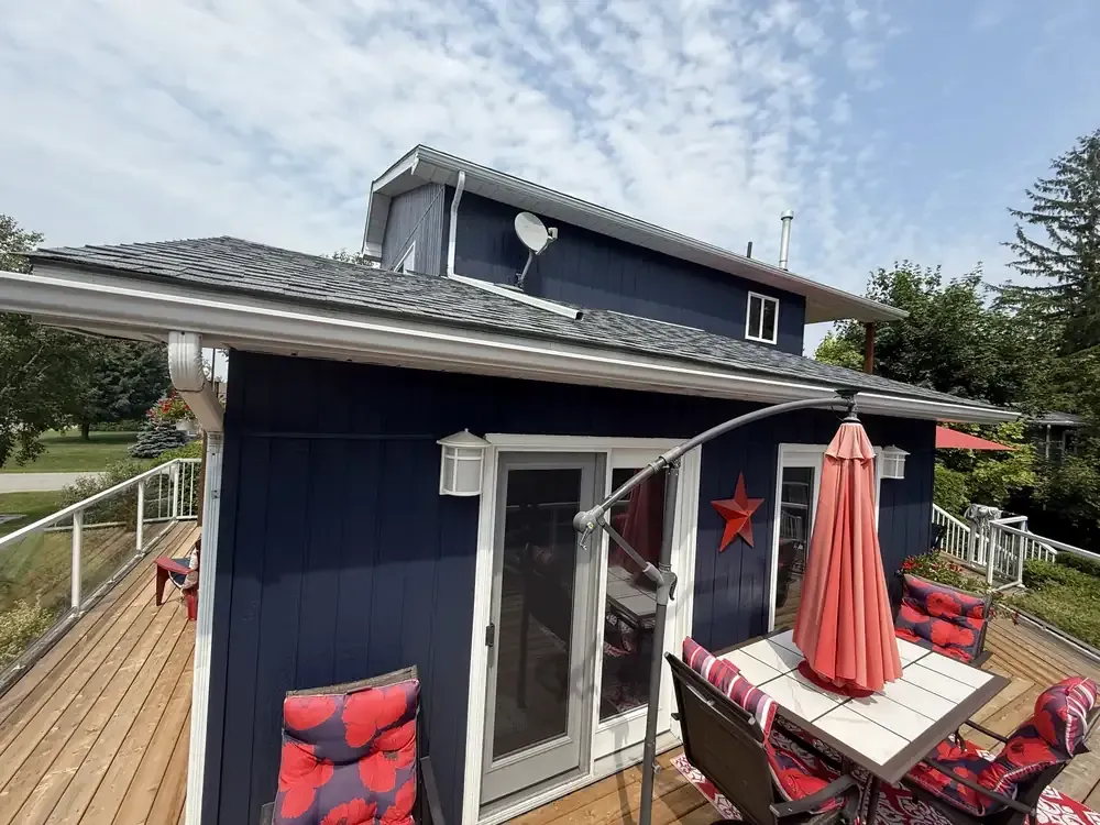 Navy cottage and deck painted by Turtle Painting