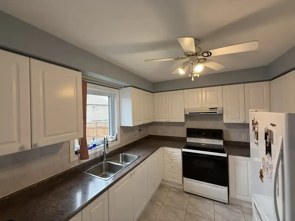 White painted kitchen cabinets by Turtle Painting in Barrie