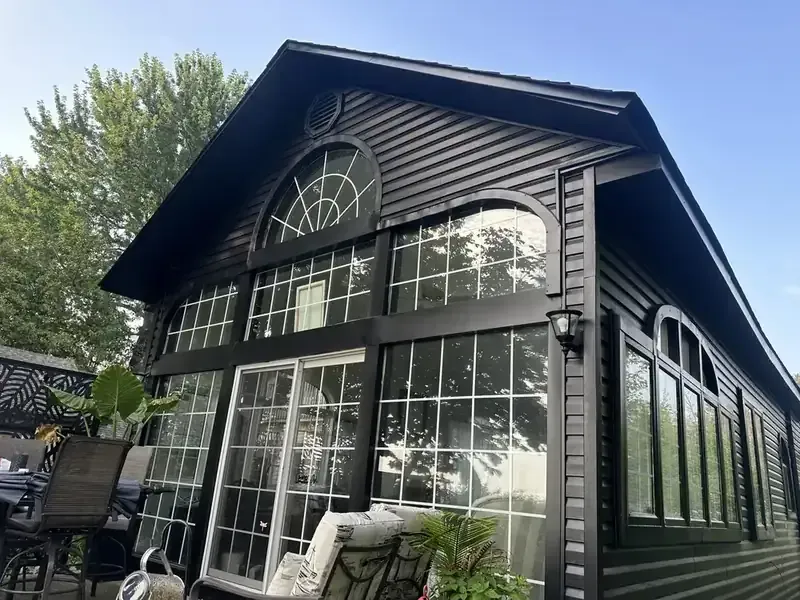 Dark siding sunroom exterior painting