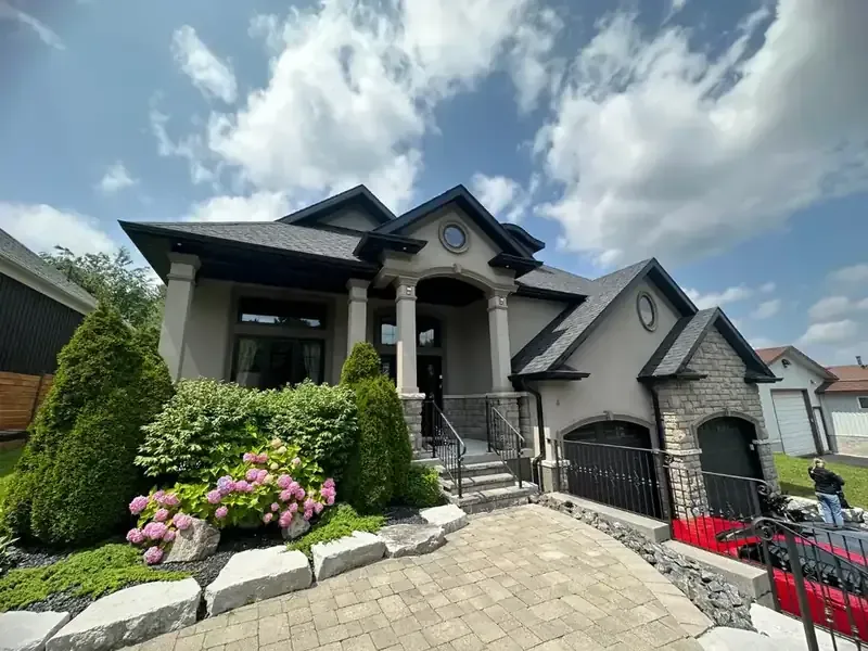 Luxury home: Grey stucco, painted by Turtle Painting