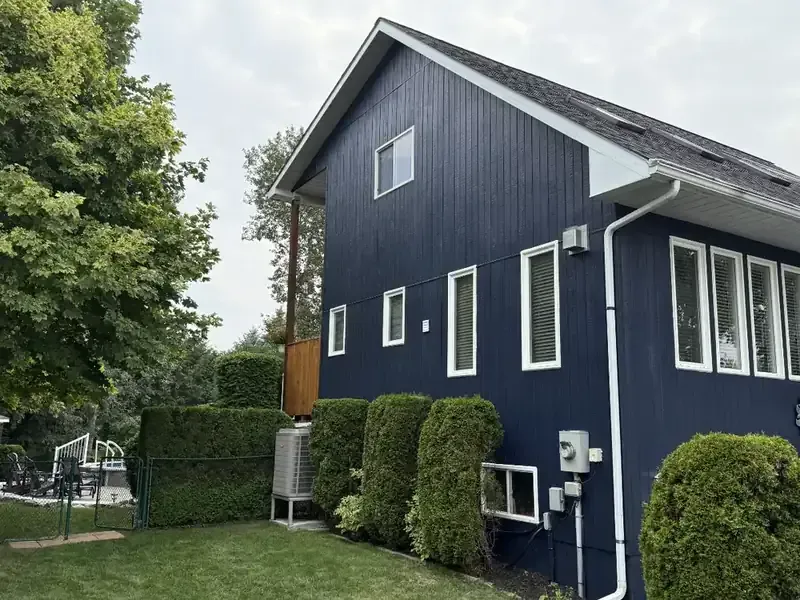 Navy siding home: Siding and white trim, painted by Turtle Painting
